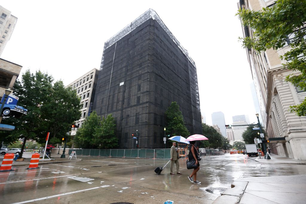 Pedestrians walk past the old Harris County District attorneys office building, 201 Fannin, September 21, 2018 in Houston. (Photo by Steve Gonzales/Houston Chronicle via Getty Images)