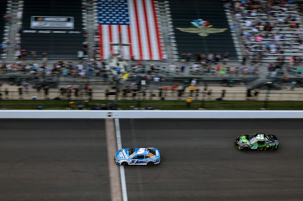 Kyle Larson, driver of the #5 HendrickCars.com Chevrolet, takes the checkered flag under caution to win the NASCAR Cup Series Brickyard 400 at Indianapolis Motor Speedway on July 21, 2024 in Indianapolis, Indiana.