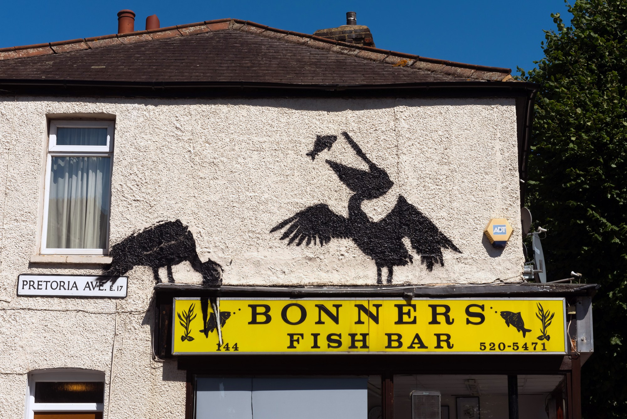 WALTHAMSTOW, ENGLAND - AUGUST 09: A mural purportedly by the artist Banksy, showing pelicans eating fish, adorns the side of Bonners fish and chip shop on August 09, 2024 in Walthamstow, England. It was the fifth artwork debuted by the elusive street artist in London this week. (Photo by Matthew Baker/Getty Images)